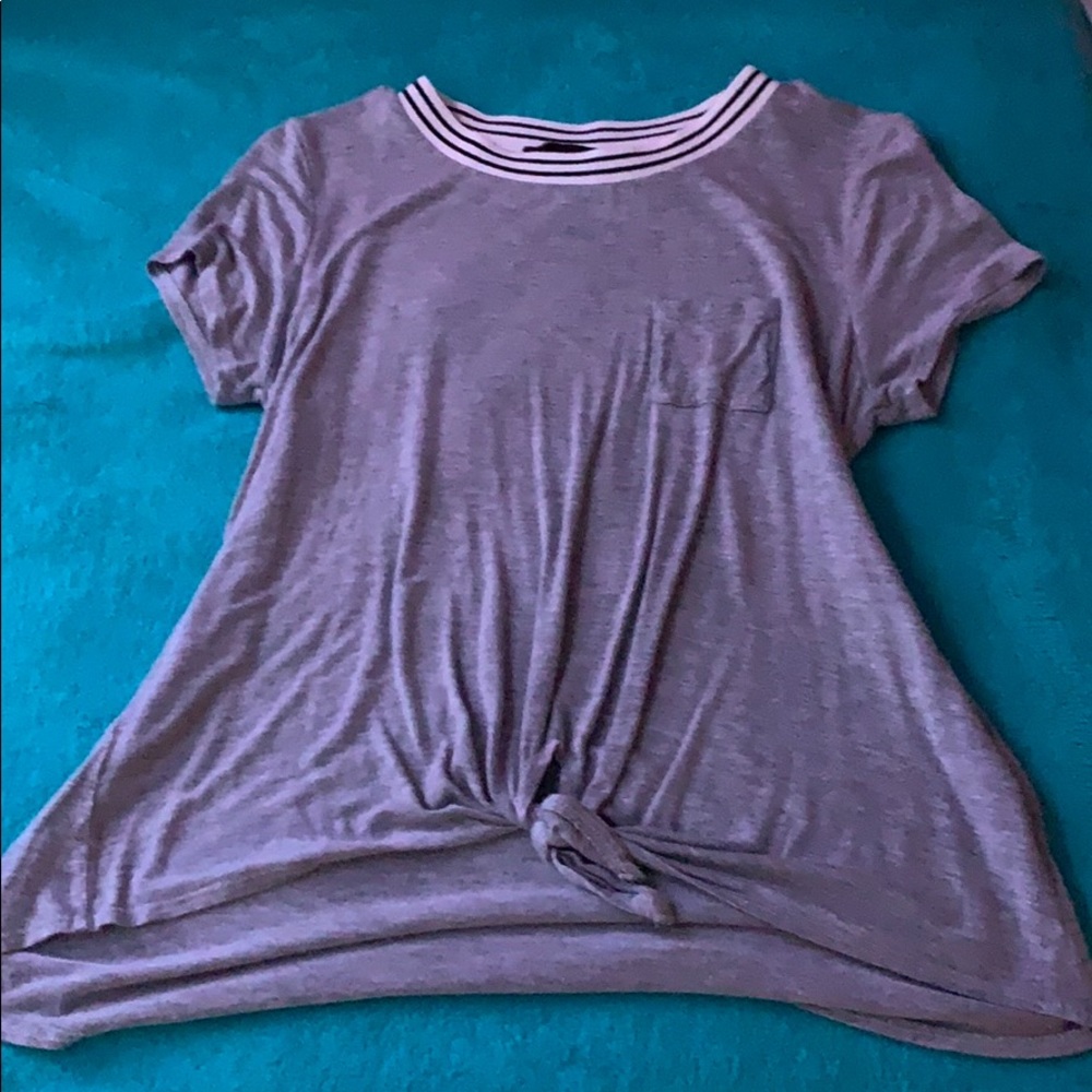 Grey T-shirt w/ white & black strips.